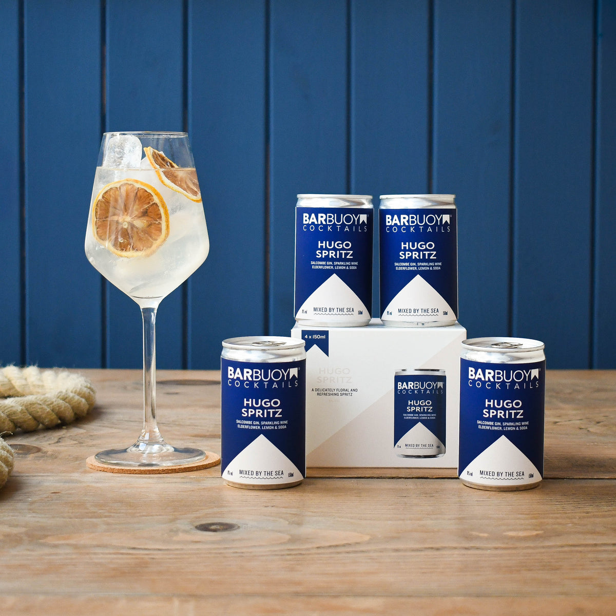 Bar Buoy Hugo Spritz 4 pack box with cans and a served Hugo Spritz in a wine glass