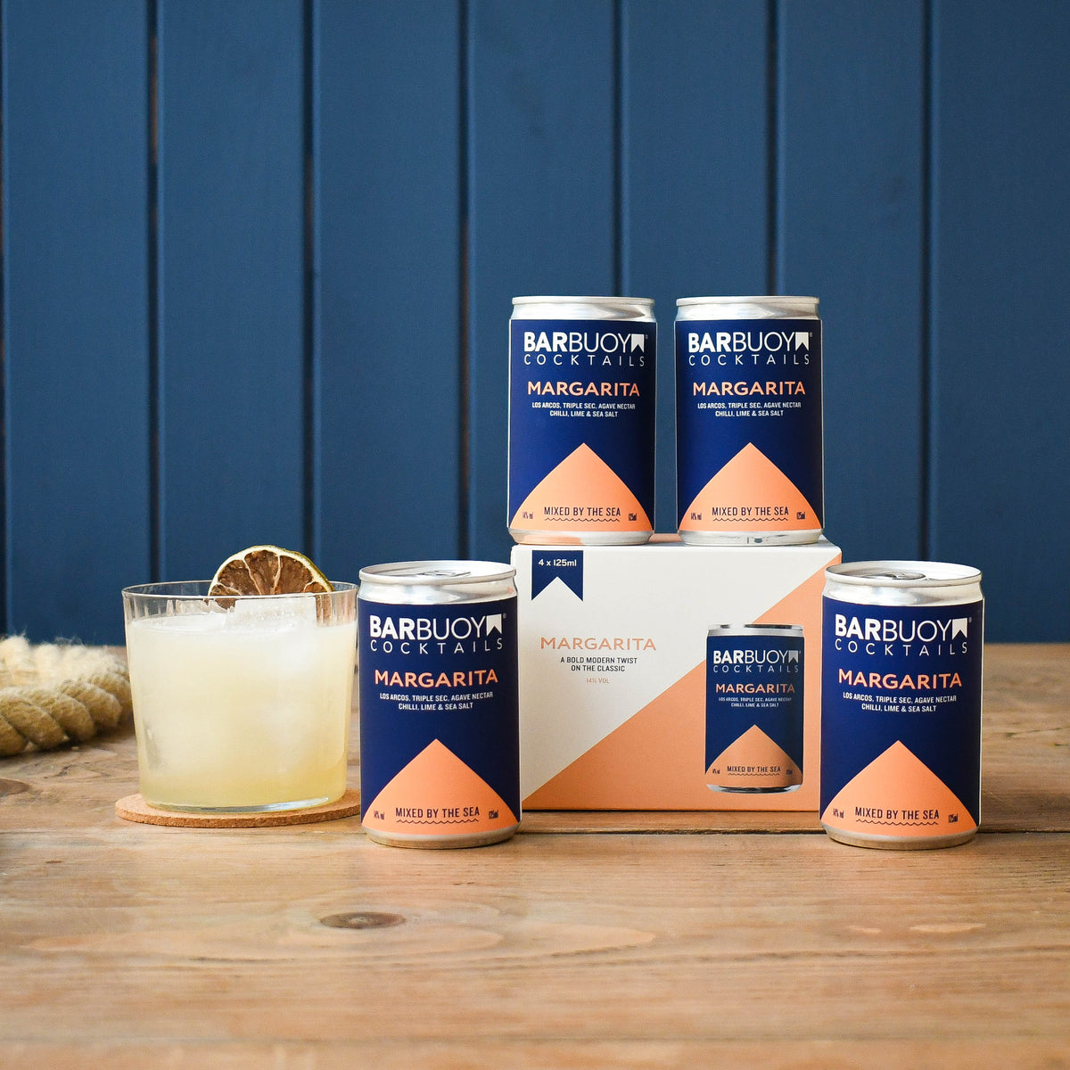 Bar Buoy Margarita 4 pack box with cans and a served Margarita over ice
