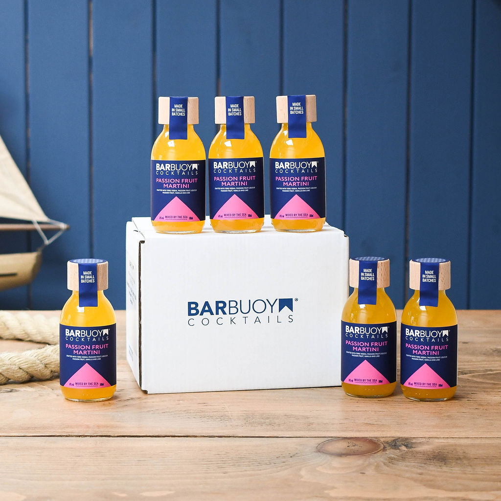 6 Bar Buoy Cocktails bottles displayed in front of a white box with a blue background
