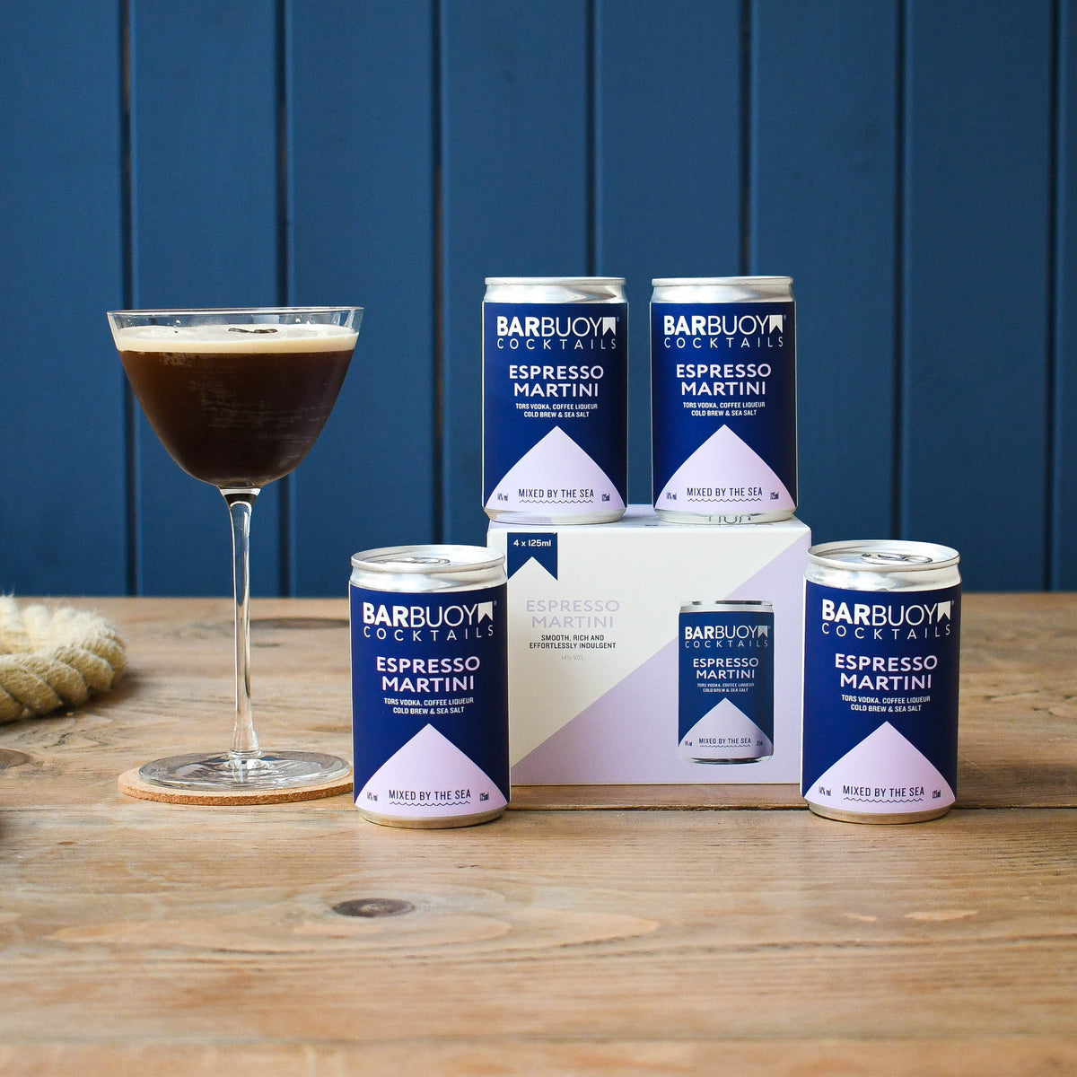 Bar Buoy Espresso Martini 4 pack box with cans and a served Espresso Martini in a coupe glass