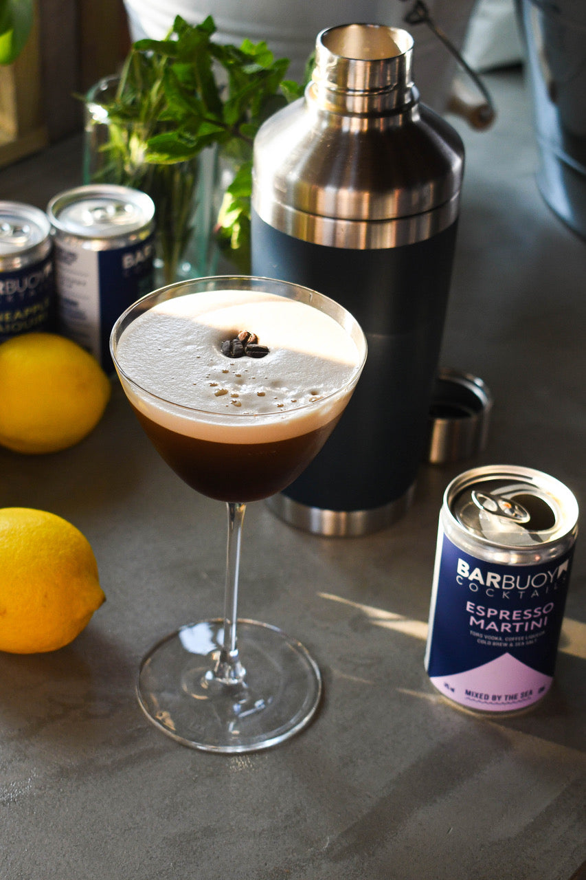 Bar Buoy Espresso Martini poured into a martini glass beside the can