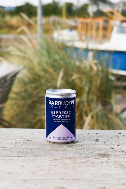 Bar Buoy Espresso Martini can on a wooden table by the coast